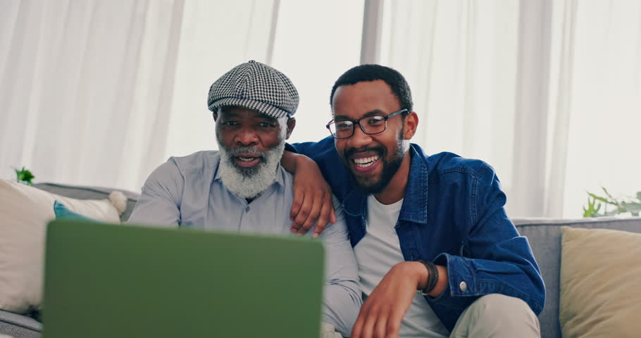 Senior father, man and sport watching on laptop in a living room at home with app streaming online. Conversation, family and internet with celebration, web subscription and computer with game win Royalty-Free Stock Footage #1107822591
