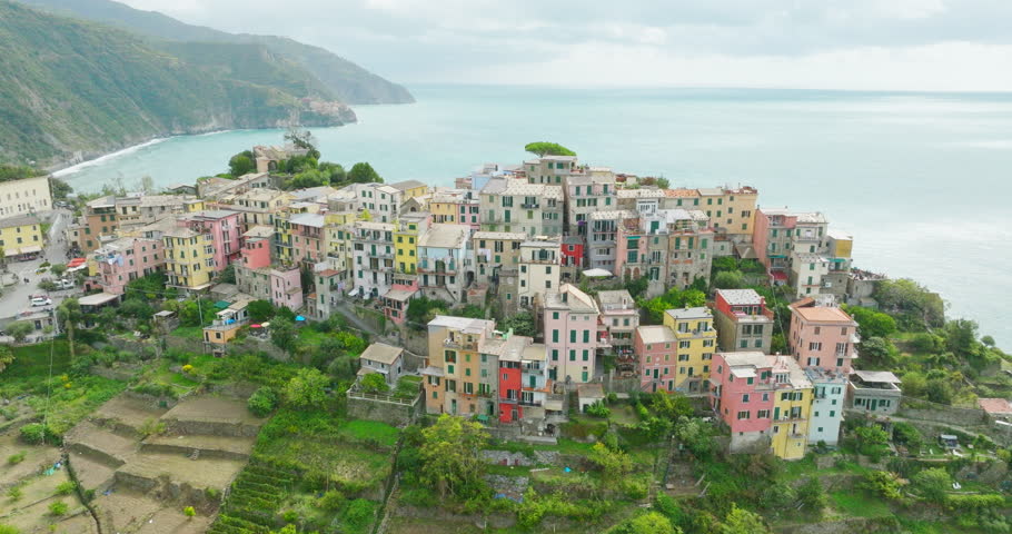 Aerial drone landscape of Corniglia, Italy Colorful Cliffside Town the Seaside Mountainous of famous Cinque Terre, Liguria, Northern Italia on Tyrrhenian sea in summer day. Coastal travel village.
