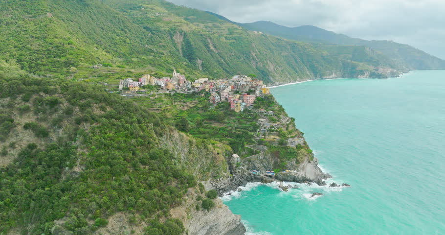 Aerial drone landscape of Corniglia, Italy Colorful Cliffside Town the Seaside Mountainous of famous Cinque Terre, Liguria, Northern Italia on Tyrrhenian sea in summer day. Coastal travel village.