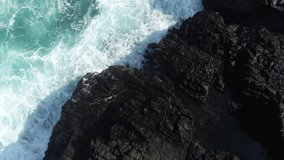 Menganti Beach Kebumen, Indonesia - Aerial video (drone) of the waves of the big rocky beach above view (Hight Angle)