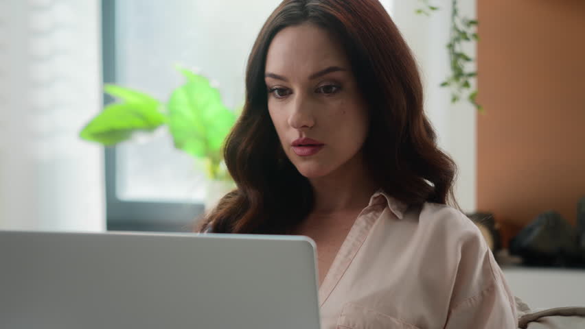 Caucasian pensive adult girl young woman businesswoman with laptop thinking business idea working with computer remote freelance task thoughtful think confused puzzled concerned problem at home office Royalty-Free Stock Footage #1107840603