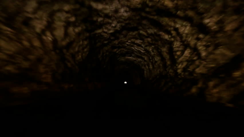 Camera Car Gorpo view trough Old WWI Dark Tunnel under Julian Alps  - Driving on Mount Mangart - Infinity stone Tunnel with Light at the end of it  Royalty-Free Stock Footage #1107846555