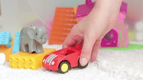 Cleaning in the children's room. Collect children's toys, close-up. Large design details. Toys for small children - Powered by Shutterstock - Get 15% off with code: PIKWIZARD15