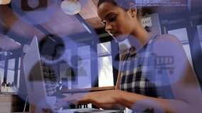 Animation of icons, computer language, low angle view of biracial woman working on laptop in cafes. Digital composite, multiple exposure, shopping, protection, security, drink and technology concept. - Powered by Shutterstock - Get 15% off with code: PIKWIZARD15