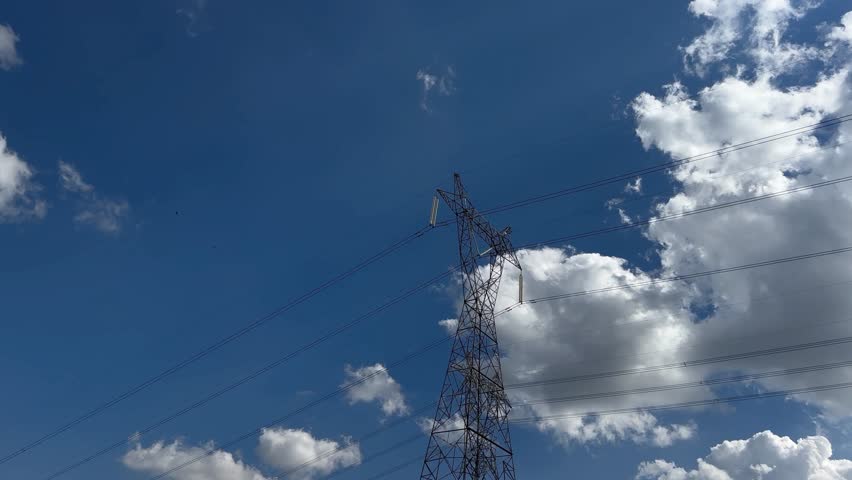 Electrical transmission tower clouds timelapse blu sky. | Shutterstock HD Video #1107860463