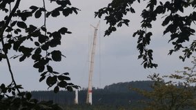 a wind turbine construction site in a forest video