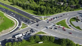 Rotating video of busy intersection. Recorded from an overhead perspective by using a drone.