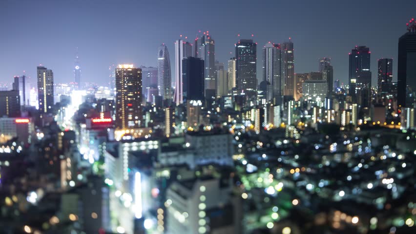 Night time lapse of the till buildings of Shinjuku in Tokyo Japan. Shot with a tilt-shift lens for a miniature effect.