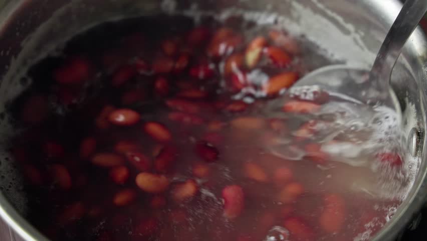 Closeup of soaked kidney beans, Rajma, or Phaseolus vulgaris beans in a pan for cooking gravy at home Royalty-Free Stock Footage #1107869959
