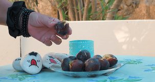 Peeling fresh Figs in Greece