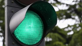 Green Traffic Light closing close up 