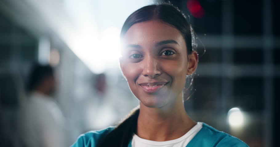 Face, nurse and smile in hospital for trust, help and professional about us in night healthcare and wellness. Portrait, Indian woman and medical student working late with medicine confidence or pride Royalty-Free Stock Footage #1107873777