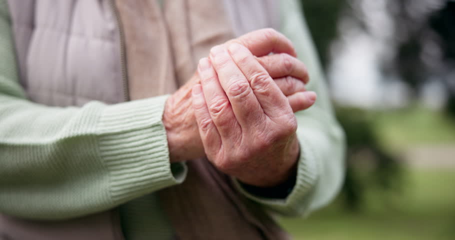 Hands, pain and a senior person with arthritis outdoor at a park in summer closeup during retirement. Anatomy, osteoporosis or joint massage with an elderly adult in a garden for a medical issue Royalty-Free Stock Footage #1107886985