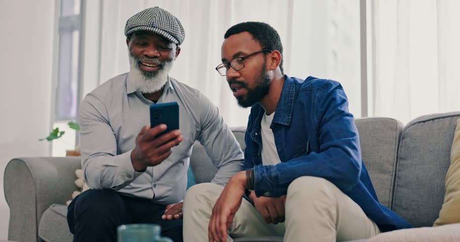 Home, father and son with a smartphone, help and connection with network, social media and teaching. Family, black men or senior person with a cellphone, mobile app or explain with email notification
