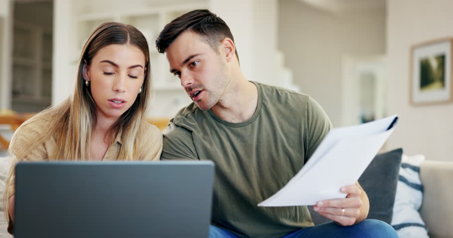 Laptop, planning or couple with budget paperwork, mortgage or banking documents together at home. Man talking or woman speaking of financial bills debt, investment portfolio or insurance on loan