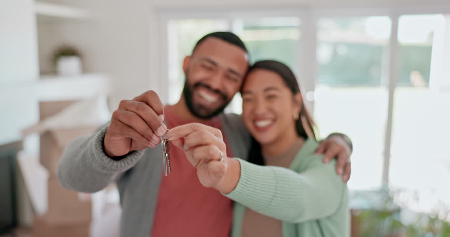 Happy couple, real estate and keys in new home, property or building investment in living room. Portrait of man and woman or homeowner smile in happiness for house loan, buying or moving in apartment Royalty-Free Stock Footage #1107887139
