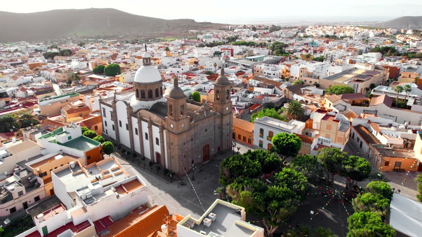 Aguimes cityscape with the Parish church of San Sebastian in Gran Canaria, Canary Islands, Spain. Aerial view of the charming town of Aguimes on the beautiful island of Gran Canaria.