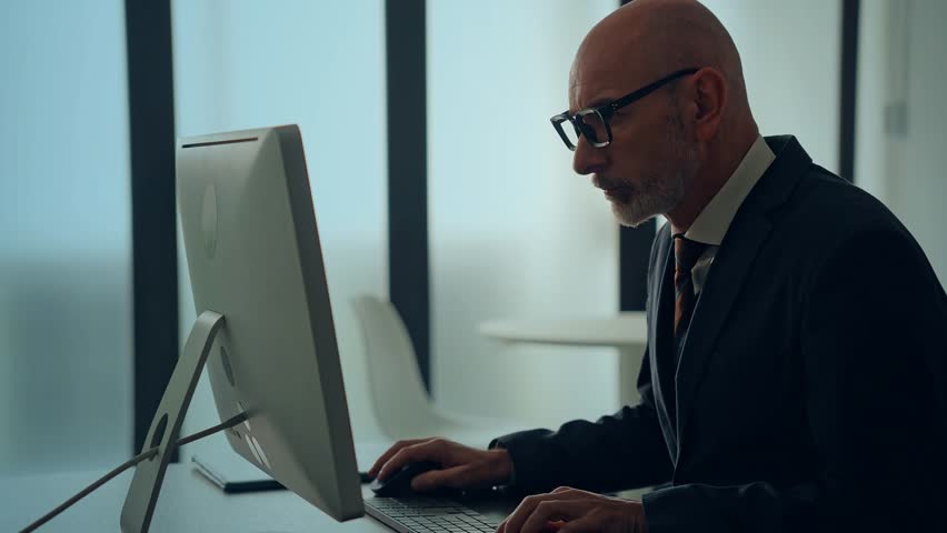 Middle aged businessperson working in office and global currency concept. Foreign exchange. Financial technology. Fintech.