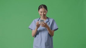Asian Female Doctor With Stethoscope Using Smartphone While Walking On Green Screen Background In The Hospital
 - Powered by Shutterstock - Get 15% off with code: PIKWIZARD15