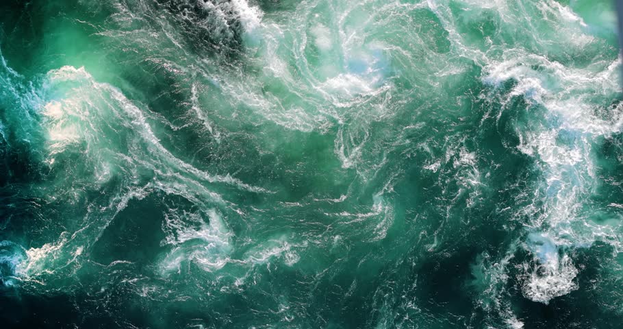 Blue waves of water of the river and the sea meet each other during high tide and low tide.