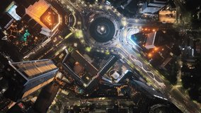Top view, Aerial view of traffic at roundabout around Selamat Datang monument in Jakarta at night