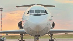 Close up Shot of a Brand New Airplane Standing in a Aircraft Maintenance Hangar. Business plane jet on parking. High quality FullHD footage