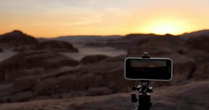 Smartphone on tripod in the desert shooting sunset Egypt