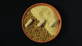 Fenugreek in three forms: seeds, powder and pills. Fenugreek used in herbal medicine. Nutritional supplement. Soothe upset stomach and digestive problems. Hulbah pills Reduce menstrual cramps.