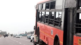 HD Video : Towing bus on highway road during day time.  