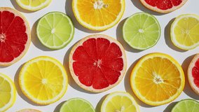 Sliced fresh citrus fruits grapefruit, orange, lemon, lime, kiwi rotate turn in sunlight isolated white background for your top view design. Healthy fruit. Summer fresh fruit snack concept. Vitamin C - Powered by Shutterstock - Get 15% off with code: PIKWIZARD15