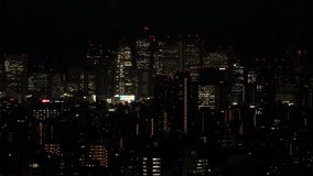TOKYO, JAPAN : Aerial high angle sunrise CITYSCAPE of TOKYO. View of office buildings at downtown area around Shinjuku. Japanese urban metropolis concept 4K video. Time lapse shot, night to morning.