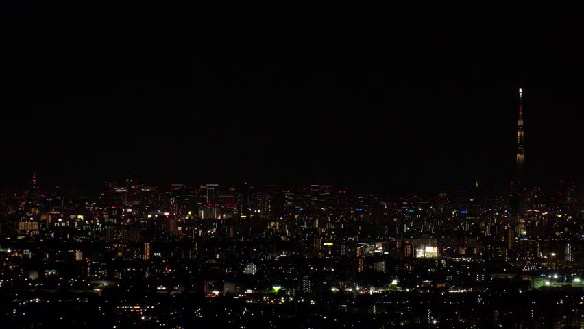 TOKYO, JAPAN : Aerial high angle sunrise view of CITYSCAPE of TOKYO and MOUNT FUJI. Rising sun and buildings at downtown area. Japanese city life and nature concept. Time lapse shot, night to morning.