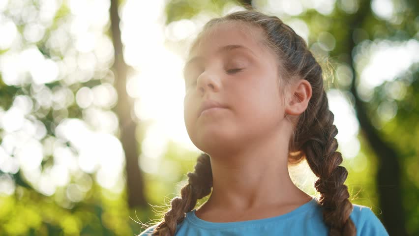 child closed eyes. little girl closed her a eyes dreaming about the future in the forest in nature in the park. happy family kid dream concept. happy family kid dream concept lifestyle Royalty-Free Stock Footage #1107936081