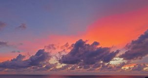 
aerial view amazing colorful sky in stunning sunset above to the sea.
Nature video High quality footage. 
Scene of Colorful romantic sky sunset background.
cloud in beautiful sky at sunset background