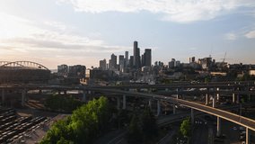 Aerial View Shot of Seattle, Washington USA, summer vibes, green trees, sun shining, downtown, rise up crane shot