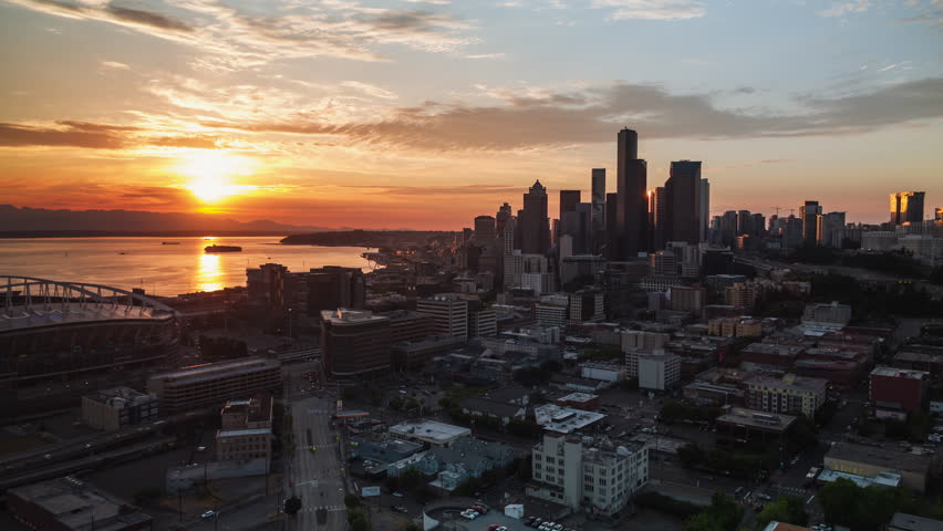 Establishing Aerial View Shot of Seattle WA, Washington USA, Breathtaking Sunset, downtown, push back reveal shot