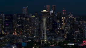 Aerial View Shot of Seattle at night evening, Washington USA, close, dark blue, slow circling left, Space Needle