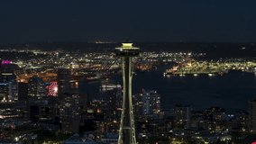 Aerial View Shot of Seattle at night evening, Washington USA, close, dark night, circling right fast, Space Needle and downtown