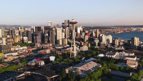 Aerial View Shot of Seattle, Washington USA, summer vibes, green trees, sun shining, Space Needle, downtown, circle right