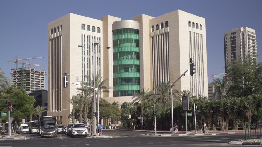 Beersheba, Israel - 14 July 2019: Crossroads with jewish pedestrians and the palace of justice  courthouse of law southjudicial district in Israel. Editorial