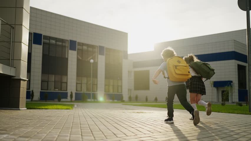Little School Kids Playing And Running In School Yard, Go To Classes, Boy And Girl With Backpacks Royalty-Free Stock Footage #1107960813