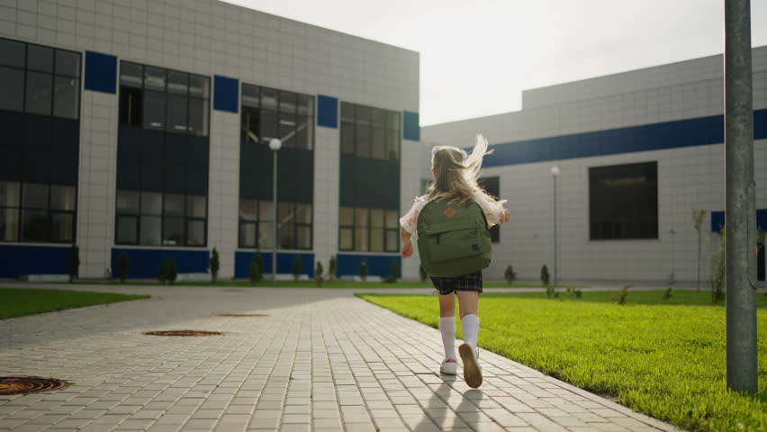 Caucasian Little Girl With Blonde Hair And School Backpack Running To School, Education For Children Royalty-Free Stock Footage #1107960839