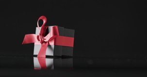 Animation of cyber monday sale text over gift box. Sales, retail, cyber shopping, digital interface, communication, computing and data processing concept digitally generated video.