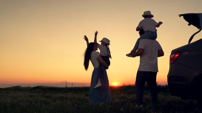 Dad with child, daughter on his shoulders, mom, children dance and admire beautiful sunset. Parents and children stopped at campsite by car. Happy family travels by car. Big family, Travel by car. Kid Royalty-Free Stock Footage #1107962327
