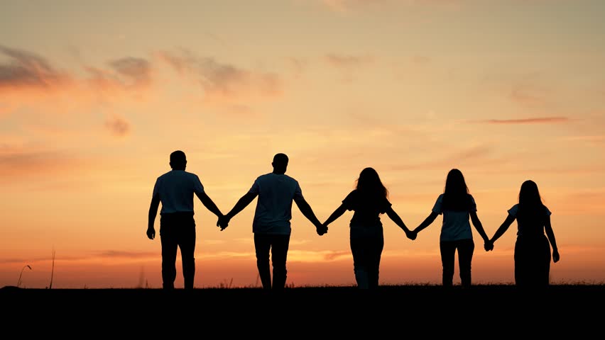 Team of people look at their future together at sunset, park. Group of business people outdoors raise their hands to sky. Human resources. Community of people joint prayer. Unity of group of people Royalty-Free Stock Footage #1107962337