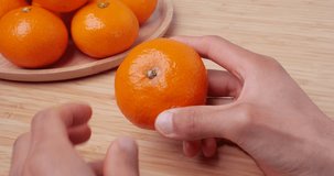 4K video of tangerine peeling on a table.
Recorded with a sound-collecting microphone.