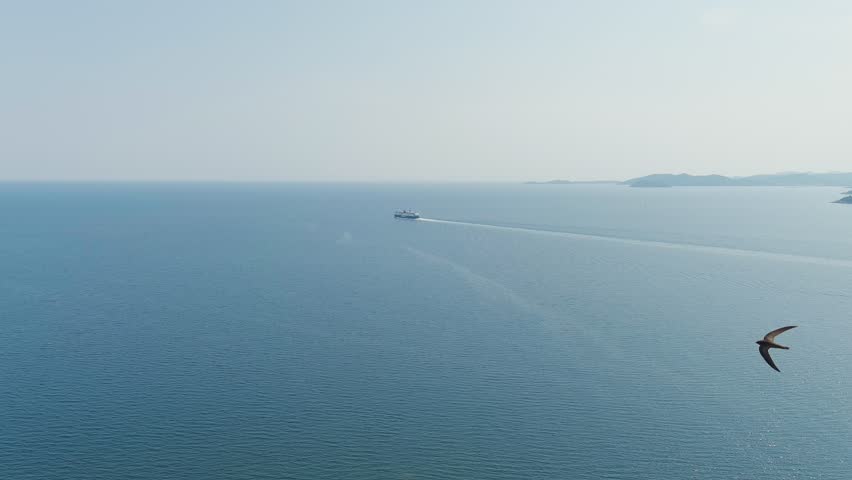 Kavala, Greece. Kavala Fortress. The ferry leaves the port. Historic city center. Aegean Sea. Summer, Aerial View, Departure of the camera