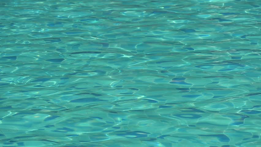 water wave slow motion on blue swimming pool, beautiful pool texture background