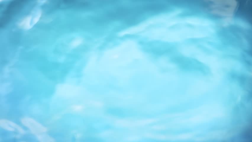Super Slow Motion Shot of Waving Light Blue Water Surface at 1000fps.