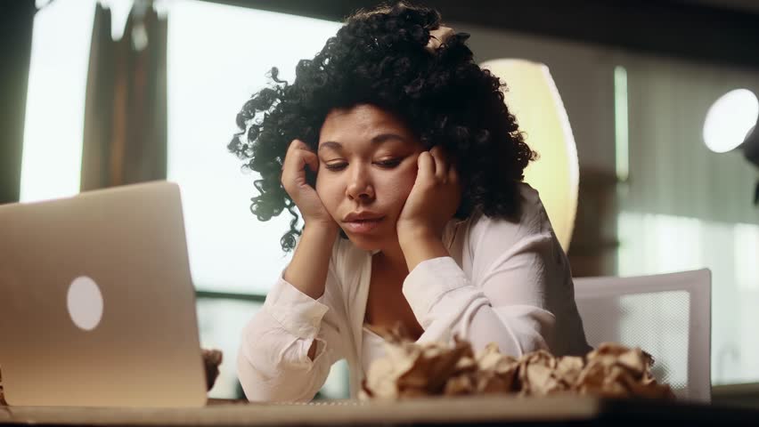 Portrait of exhausted young woman with failed ideas while take a break at home Tired female with creative block or lack of inspiration indoors	